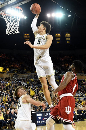 Moritz Wagner (13) and D.J. Wilson (5)