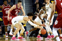 D.J. Wilson (5), Derrick Walton Jr. (10), and Duncan Robinson (22)