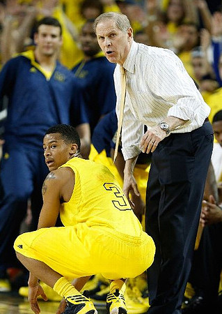 Trey Burke (3) and John Beilein