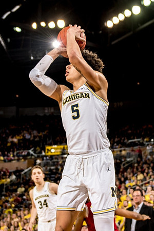 D.J. Wilson (5) and Mark Donnal (34)