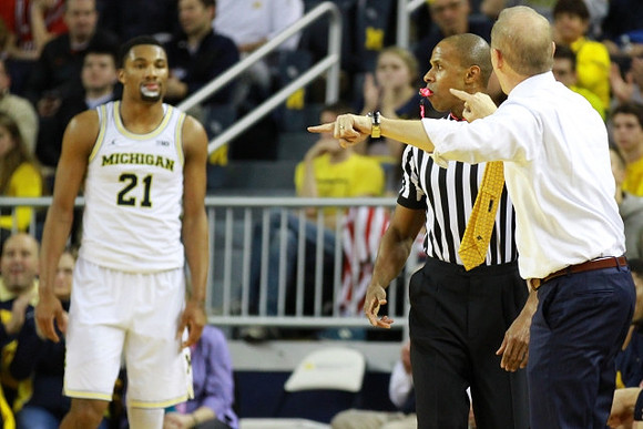 Zak Irvin (21) and John Beilein