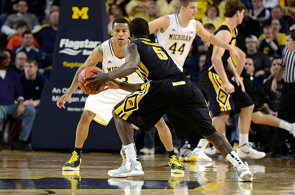 Trey Burke (3) and Max Bielfeldt (44)