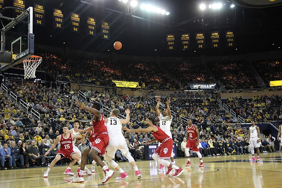 D.J. Wilson (5), Moritz Wagner (13), Muhammad-Ali Abdur-Rahkman (12), and Derrick Walton Jr. (10)