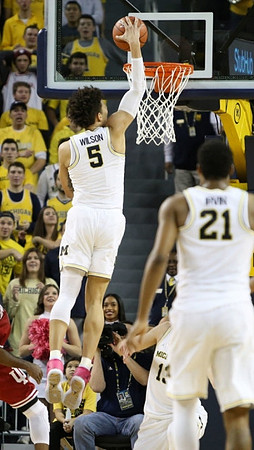 D.J. Wilson (5) and Zak Irvin (21)