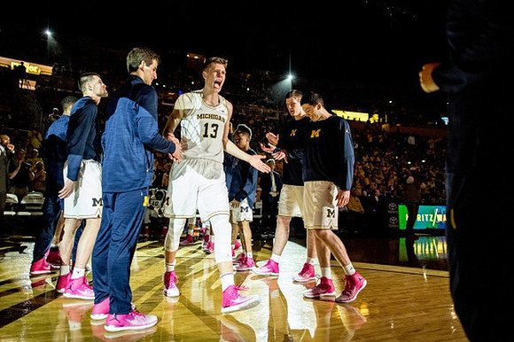 Moritz Wagner (13) and Michigan Team