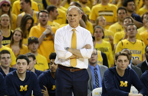Sean Lonergan (20), Ibi Watson (23), John Beilein, and Mark Donnal (34)