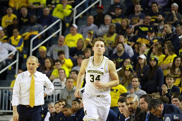 John Beilein, Mark Donnal (34), and Michigan Team