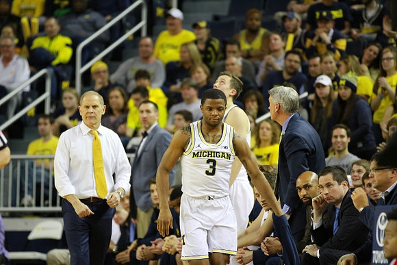 John Beilein, Xavier Simpson (3), and Michigan Team