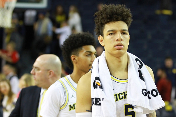 D.J. Wilson (5) and Ibi Watson (23)