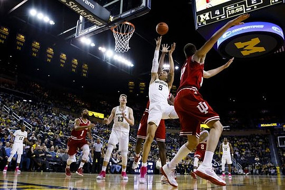 Muhammad-Ali Abdur-Rahkman (12), Moritz Wagner (13), D.J. Wilson (5), and Derrick Walton Jr. (10)