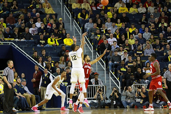 Zak Irvin (21) and Muhammad-Ali Abdur-Rahkman (12)