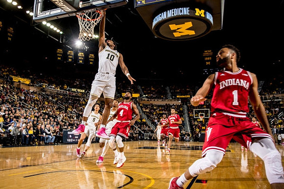 Derrick Walton Jr. (10) and D.J. Wilson (5)