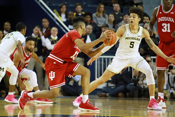 Muhammad-Ali Abdur-Rahkman (12) and D.J. Wilson (5)