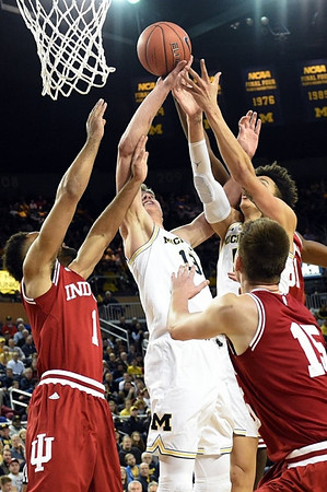 Moritz Wagner (13) and D.J. Wilson (5)