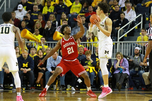 Derrick Walton Jr. (10) and D.J. Wilson (5)