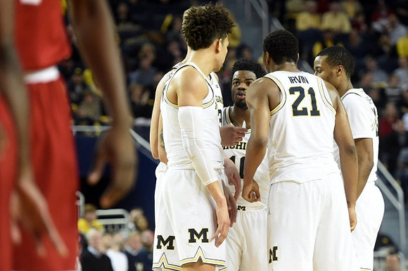 D.J. Wilson (5), Zak Irvin (21), Muhammad-Ali Abdur-Rahkman (12), Derrick Walton Jr. (10), and Moritz Wagner (13)