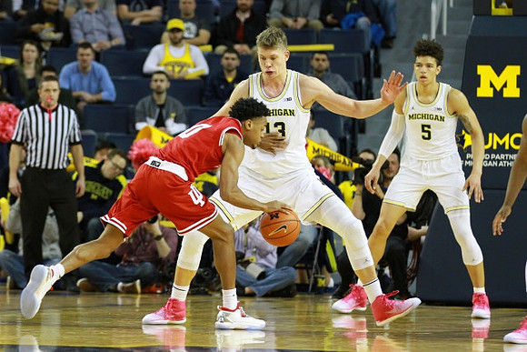 Moritz Wagner (13) and D.J. Wilson (5)