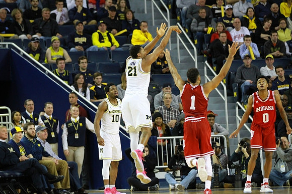 Derrick Walton Jr. (10) and Zak Irvin (21)
