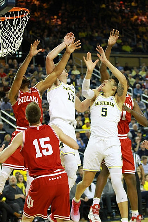 Moritz Wagner (13) and D.J. Wilson (5)