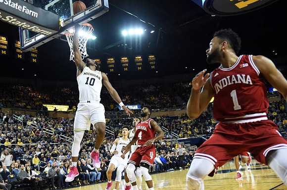 Derrick Walton Jr. (10) and D.J. Wilson (5)