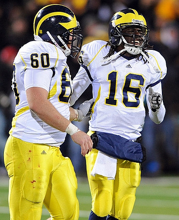 David Moosman (60) and Denard Robinson (16)