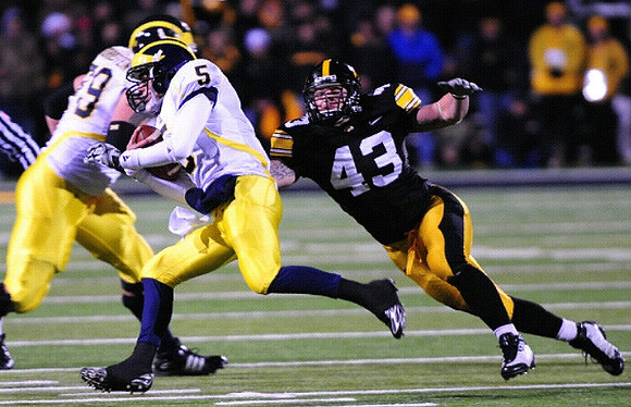 Perry Dorrestein (79) and Tate Forcier (5)