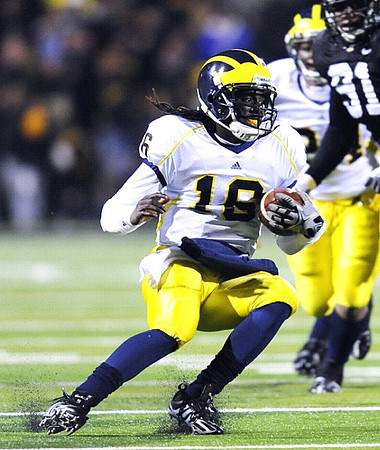 Denard Robinson (16) and Kevin Grady (24)