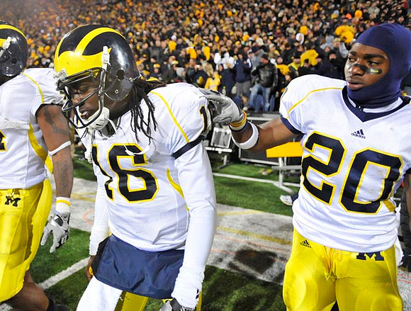 Denard Robinson (16) and Michael Shaw (20)