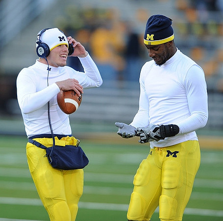 Tate Forcier (5) and Greg Mathews (13)