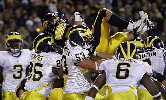 Stevie Brown (3), Kenny Demens (25), Ryan Van Bergen (53), Donovan Warren (6), and Jonas Mouton (8)