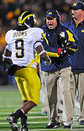 Martavious Odoms (9) and Rich Rodriguez