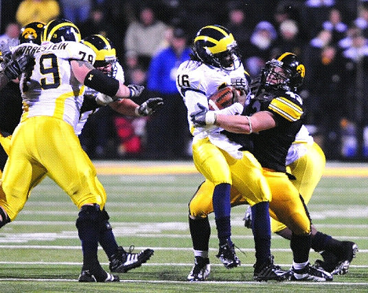 Perry Dorrestein (79) and Denard Robinson (16)
