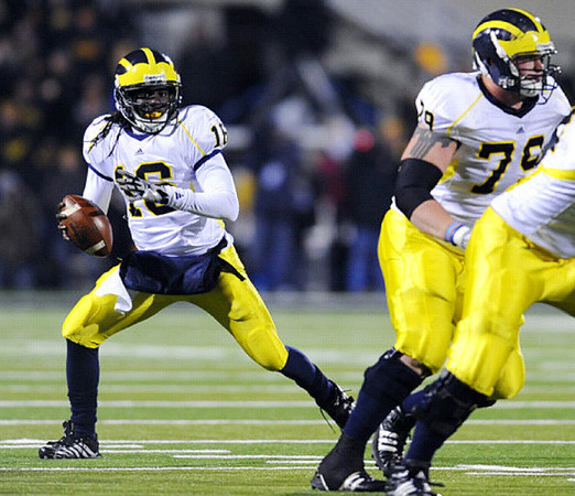 Denard Robinson (16) and Perry Dorrestein (79)