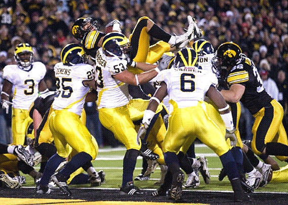 Stevie Brown (3), Kenny Demens (25), Ryan Van Bergen (53), and Donovan Warren (6)