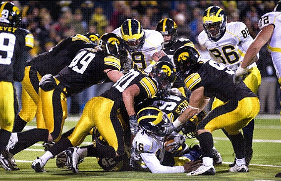 Denard Robinson (16), Perry Dorrestein (79), Kevin Koger (86), and Mark Huyge (72)