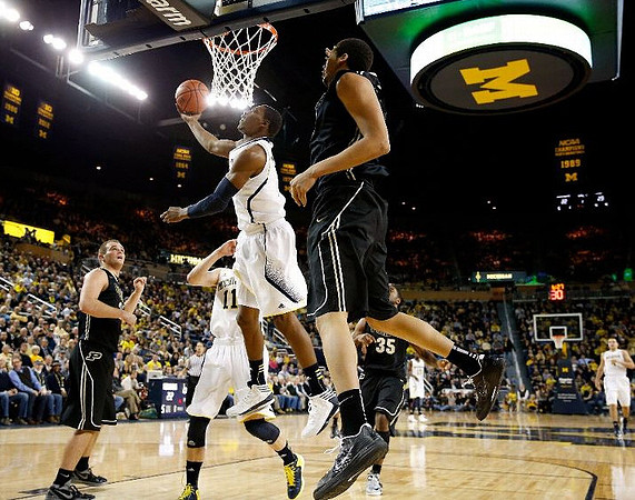 Nik Stauskas (11) and Glenn Robinson III (1)