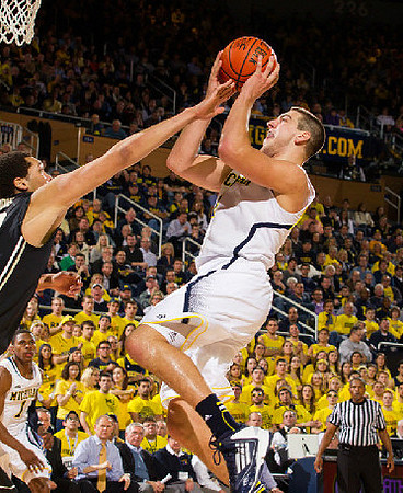 Mitch McGary (4), Glenn Robinson III (1), John Beilein, and Gary Moeller
