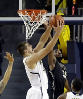 Mitch McGary (4) and Glenn Robinson III (1)