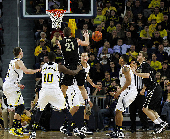 Nik Stauskas (11), Tim Hardaway Jr. (10), Mitch McGary (4), and Trey Burke (3)