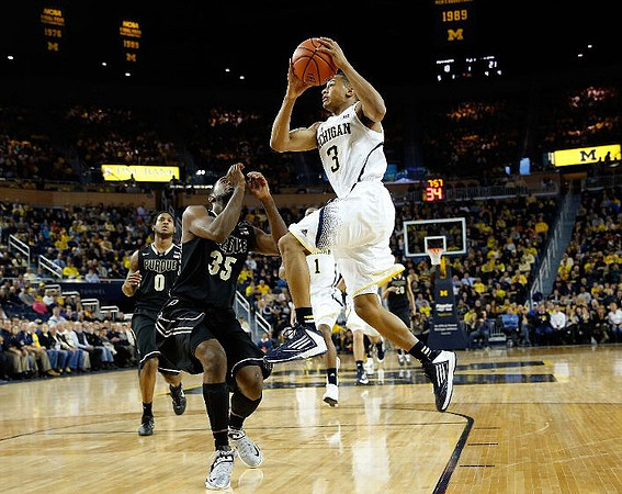 Trey Burke (3) and Glenn Robinson III (1)