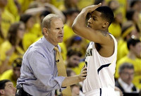 Trey Burke (3) and John Beilein
