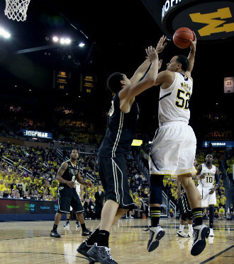 Jordan Morgan (52) and Tim Hardaway Jr. (10)