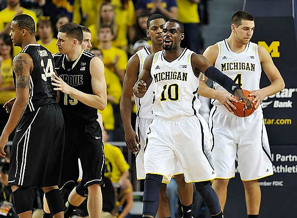 Nik Stauskas (11), Tim Hardaway Jr. (10), Glenn Robinson III (1), and Mitch McGary (4)