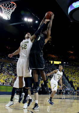 Jordan Morgan (52) and Trey Burke (3)