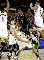 Glenn Robinson III (1), Mitch McGary (4), Nik Stauskas (11), and Trey Burke (3)
