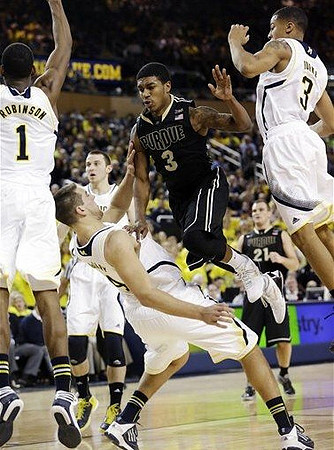 Glenn Robinson III (1), Mitch McGary (4), Nik Stauskas (11), and Trey Burke (3)