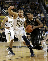 Trey Burke (3) and Jordan Morgan (52)