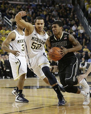 Trey Burke (3) and Jordan Morgan (52)