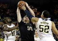 Tim Hardaway Jr. (10), Jordan Morgan (52), and Nik Stauskas (11)