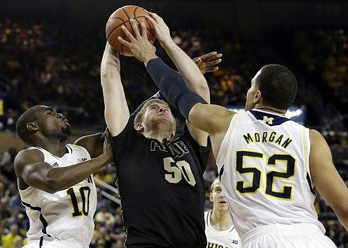 Tim Hardaway Jr. (10), Jordan Morgan (52), and Nik Stauskas (11)